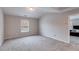 Spacious bedroom with neutral carpet, vaulted ceiling, and a window offering natural light at 209 Shelton Cir, Temple, GA 30179