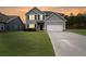 Charming two-story home features a well-manicured lawn, attached garage, and inviting curb appeal at 209 Shelton Cir, Temple, GA 30179