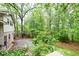 A shady backyard is covered with mature trees that provide a wooded feel at 2288 Hudson Sw Dr, Lilburn, GA 30047