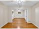 Spacious bedroom with gleaming hardwood floors and a ceiling fan at 2288 Hudson Sw Dr, Lilburn, GA 30047
