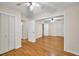 Large bedroom boasting hardwood floors, multiple closets, and several doorways at 2288 Hudson Sw Dr, Lilburn, GA 30047