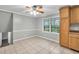Open dining area with tile floors and access to the kitchen, creating a welcoming space for meals at 2288 Hudson Sw Dr, Lilburn, GA 30047