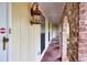 The covered entryway showcases unique brick archways and elegant lighting, enhancing the curb appeal of this inviting home at 2288 Hudson Sw Dr, Lilburn, GA 30047