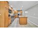 Spacious kitchen featuring stainless steel appliances, granite countertops, and an island for extra prep space at 2288 Hudson Sw Dr, Lilburn, GA 30047