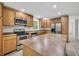 Well-lit kitchen with stainless steel appliances and generous counter space at 2288 Hudson Sw Dr, Lilburn, GA 30047