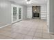 Cozy living room featuring a stone fireplace, built-in shelves, and French doors to the outside at 2288 Hudson Sw Dr, Lilburn, GA 30047