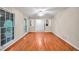 Spacious living room featuring hardwood floors and large windows, offering ample natural light at 2288 Hudson Sw Dr, Lilburn, GA 30047