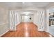 Living room with hardwood floors and decorative molding at 2288 Hudson Sw Dr, Lilburn, GA 30047