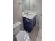 Bathroom with a toilet, vanity, and tiled floor, ideal for everyday convenience at 2514 Norwood Park Crossing, Doraville, GA 30340
