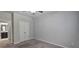 Spacious bedroom with gray carpet, closet, and view of en-suite bathroom at 2514 Norwood Park Crossing, Doraville, GA 30340