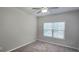 Neutral bedroom with a ceiling fan, plush carpet, and lots of natural light at 2514 Norwood Park Crossing, Doraville, GA 30340