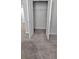 A bedroom closet with double doors, rod, and neutral carpeting at 2514 Norwood Park Crossing, Doraville, GA 30340