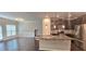 A view of an open kitchen with a stainless refrigerator, black gas stove, and granite countertops at 2514 Norwood Park Crossing, Doraville, GA 30340
