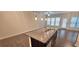 Kitchen island with granite countertop and stainless steel dishwasher at 2514 Norwood Park Crossing, Doraville, GA 30340