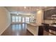 A view of an open kitchen with granite countertops, a gas stove, and stainless appliances at 2514 Norwood Park Crossing, Doraville, GA 30340