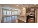 A view of an open kitchen with stainless steel appliances, a ceiling fan, and granite countertops at 2514 Norwood Park Crossing, Doraville, GA 30340