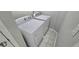 Efficient laundry room with white washer and dryer, complemented by tile flooring at 2514 Norwood Park Crossing, Doraville, GA 30340