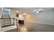 A view of the living room, stairs, and kitchen featuring dark hardwood floors at 2514 Norwood Park Crossing, Doraville, GA 30340