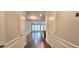 View of a hardwood floor entryway into an open living and kitchen area at 2514 Norwood Park Crossing, Doraville, GA 30340