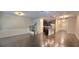Open-concept living space featuring hardwood floors, staircase and modern kitchen with island at 2514 Norwood Park Crossing, Doraville, GA 30340