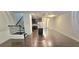 Open-concept living space featuring hardwood floors, staircase and modern kitchen at 2514 Norwood Park Crossing, Doraville, GA 30340