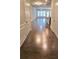 View of a hardwood floor entryway into an open living and kitchen area at 2514 Norwood Park Crossing, Doraville, GA 30340