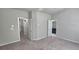 Main bedroom with en-suite bathroom access and neutral carpet at 2514 Norwood Park Crossing, Doraville, GA 30340