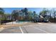 Outdoor community pool surrounded by a fence and lush greenery at 2514 Norwood Park Crossing, Doraville, GA 30340