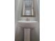 A close-up view of a bathroom sink with a silver-framed mirror at 2514 Norwood Park Crossing, Doraville, GA 30340
