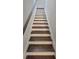 Carpeted staircase with painted risers and a stained handrail at 2514 Norwood Park Crossing, Doraville, GA 30340