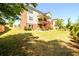 View of the home's backyard and covered patio area at 4041 Woodward Walk Ln, Suwanee, GA 30024