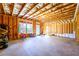 Bright unfinished basement with exposed wooden beams, offering potential for customization and expansion at 4041 Woodward Walk Ln, Suwanee, GA 30024