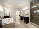 Bright bathroom with granite countertops, vanity and separate walk-in shower at 4041 Woodward Walk Ln, Suwanee, GA 30024