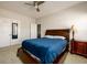 Bedroom with neutral carpet, ceiling fan, and walk-in closet at 4041 Woodward Walk Ln, Suwanee, GA 30024