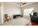 Spacious bedroom with a ceiling fan, a bright window with blinds and comfortable decor at 4041 Woodward Walk Ln, Suwanee, GA 30024