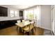 Comfortable dining area with a light-filled space thanks to lots of big windows at 4041 Woodward Walk Ln, Suwanee, GA 30024
