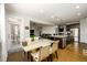 Bright dining area adjacent to a modern kitchen and a cozy living space at 4041 Woodward Walk Ln, Suwanee, GA 30024