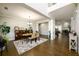 Spacious dining area with hardwood floors, elegant chandelier, and open access to other living spaces at 4041 Woodward Walk Ln, Suwanee, GA 30024
