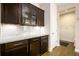 Modern kitchen with dark cabinetry, granite countertops, and stainless steel appliances at 4041 Woodward Walk Ln, Suwanee, GA 30024