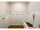 Mudroom features a coat rack, seating and hardwood floors at 4041 Woodward Walk Ln, Suwanee, GA 30024