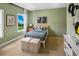 Cozy bedroom with lots of natural light, calming color scheme, and modern decor at 5515 Misty Glen Ln, Cumming, GA 30040