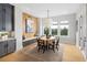 Bright dining area featuring a built-in bench, stylish decor, and ample natural light at 5515 Misty Glen Ln, Cumming, GA 30040