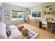 Bright and inviting home office with a view and plenty of workspace at 5515 Misty Glen Ln, Cumming, GA 30040
