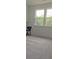 Bedroom featuring carpet, base trim and large windows at 2962 Girard Ln, Duluth, GA 30097