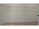 Spacious walk-in closet with wire shelving and plush carpeting, providing ample storage and organization solutions at 2962 Girard Ln, Duluth, GA 30097