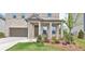 Charming brick home featuring a welcoming front porch and well-manicured landscaping at 2962 Girard Ln, Duluth, GA 30097