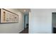 Bright hallway with art and view into other rooms at 2962 Girard Ln, Duluth, GA 30097