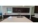 Modern kitchen featuring stainless steel appliances, dark cabinets, and white countertops at 2962 Girard Ln, Duluth, GA 30097