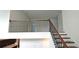 Landing with wooden railing and iron spindles overlooking the lower level and stairs, filled with natural light at 2962 Girard Ln, Duluth, GA 30097