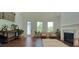 Spacious living room with fireplace, hardwood floors, and ample natural light at 2962 Girard Ln, Duluth, GA 30097
